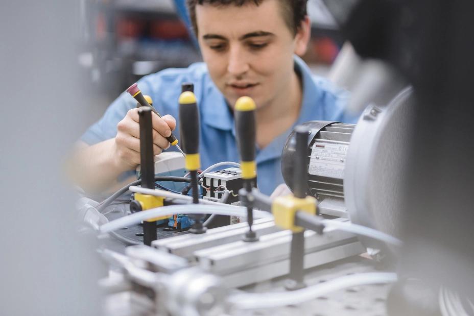 test technician installing test equipment in the TIYO laboratory