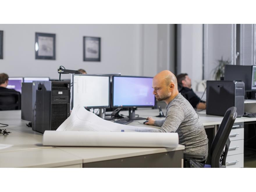 TIYO specialist works in the office on a digital model for the automotive industry TIYO specialist works in the office on a digital model for the automotive industry