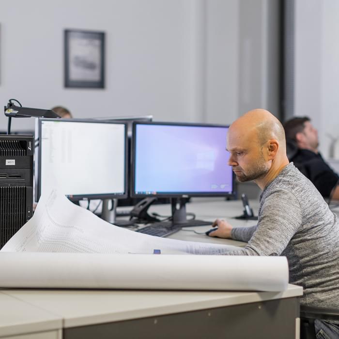 TIYO specialist works in the office on a digital model for the automotive industry