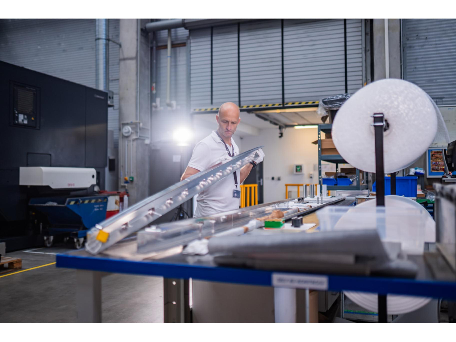 TIYO specialist holding an aerospace aluminium component TIYO specialist holding an aerospace aluminium component