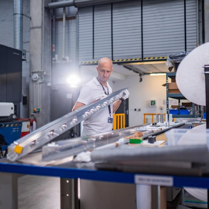 TIYO specialist holding an aerospace aluminium component