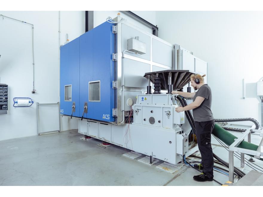 TIYO specialist works with the climate chamber during vibration tests TIYO specialist works with the climate chamber during vibration tests