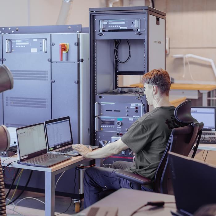 TIYO specialist analyses high-voltage electrical tests on a computer